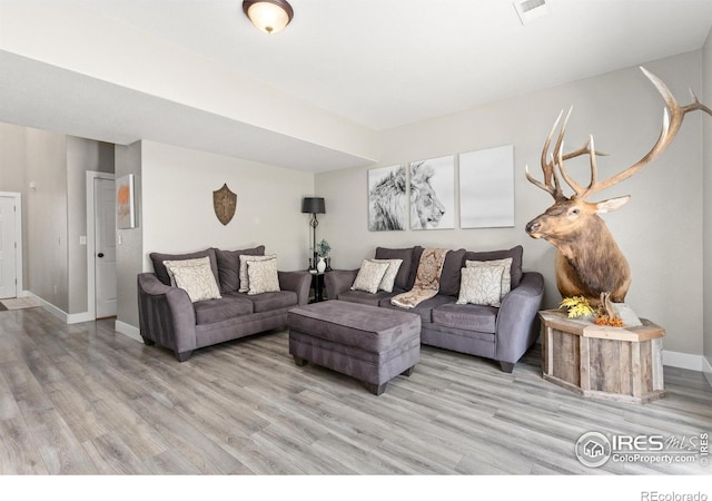 9930 Cascade St, Firestone, CO 80504 - living area featuring light wood finished floors and baseboards