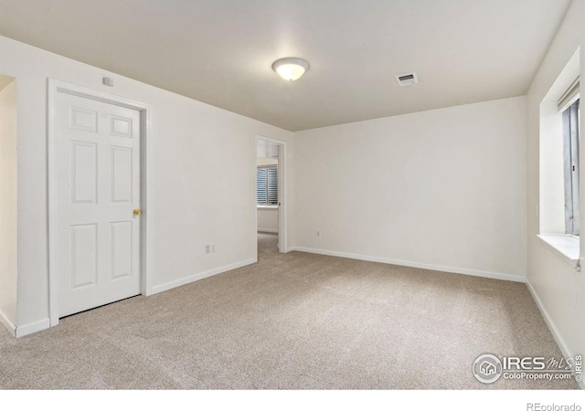1382 Warbler St, Loveland, CO 80537 - carpeted empty room with baseboards