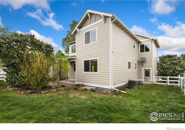 1382 Warbler St, Loveland, CO 80537 - back of property with cooling unit and a patio