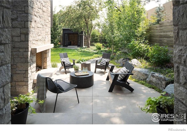 2828 4th St, Boulder, CO 80304 - view of patio / terrace with an outdoor living space with a fireplace
