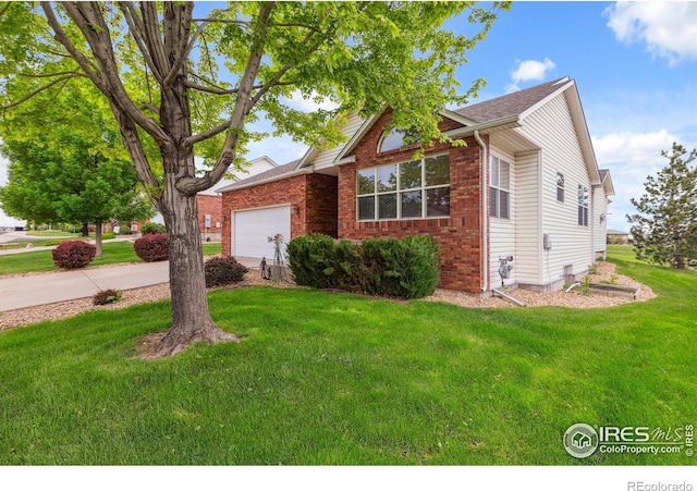 6911 W 22nd St, Greeley, CO 80634 - view of front of home featuring an attached garage, a front yard, concrete driveway, and brick siding
