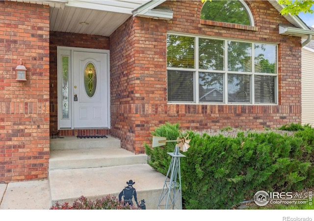 6911 W 22nd St, Greeley, CO 80634 - view of exterior entry with brick siding