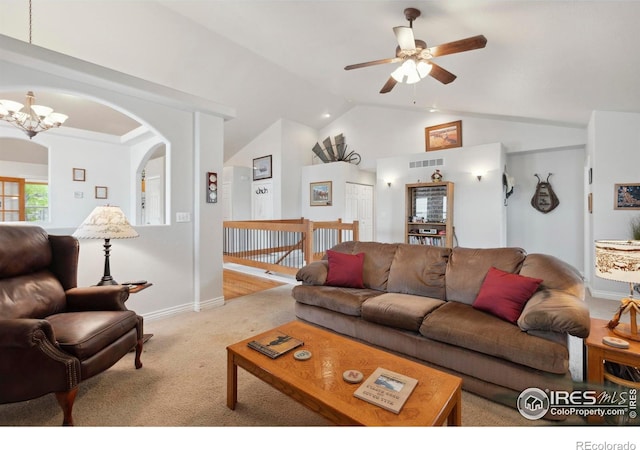 6911 W 22nd St, Greeley, CO 80634 - living room with lofted ceiling, light carpet, a ceiling fan, a chandelier, and arched walkways
