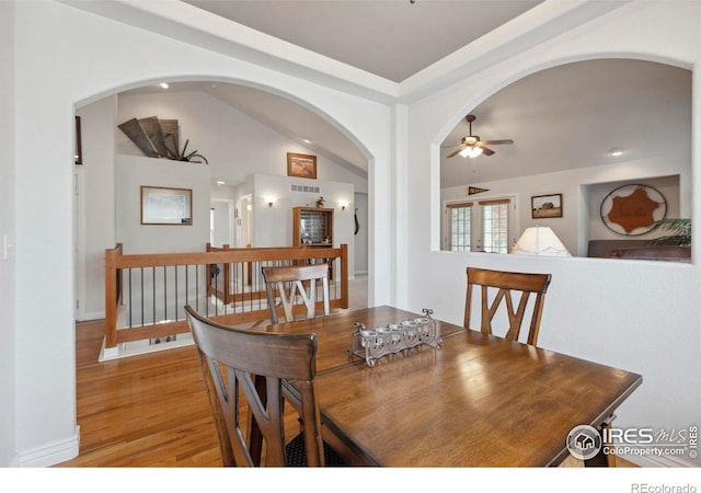 6911 W 22nd St, Greeley, CO 80634 - dining room featuring a ceiling fan, light wood finished floors, recessed lighting, and arched walkways
