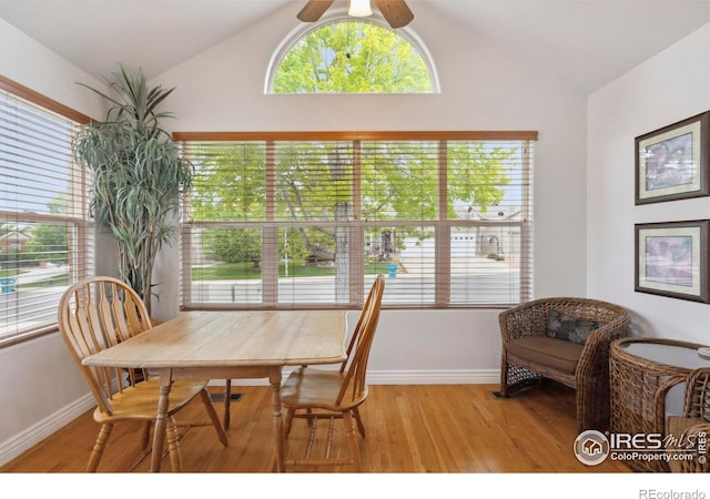 6911 W 22nd St, Greeley, CO 80634 - dining area featuring lofted ceiling, baseboards, light wood finished floors, and a ceiling fan