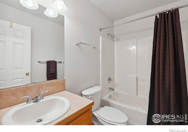 6911 W 22nd St, Greeley, CO 80634 - bathroom with shower / bath combo, toilet, vanity, and a textured wall