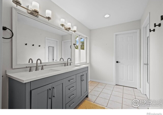 1409 Quince Ave, Boulder, CO 80304 - bathroom featuring double vanity, tile patterned flooring, baseboards, and recessed lighting