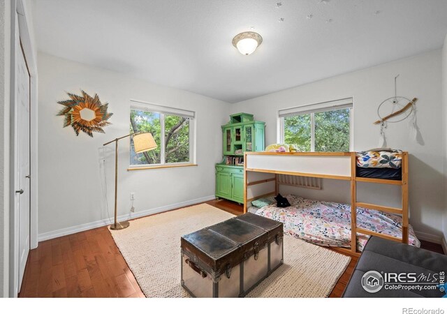1409 Quince Ave, Boulder, CO 80304 - home office with wood finished floors, plenty of natural light, and baseboards