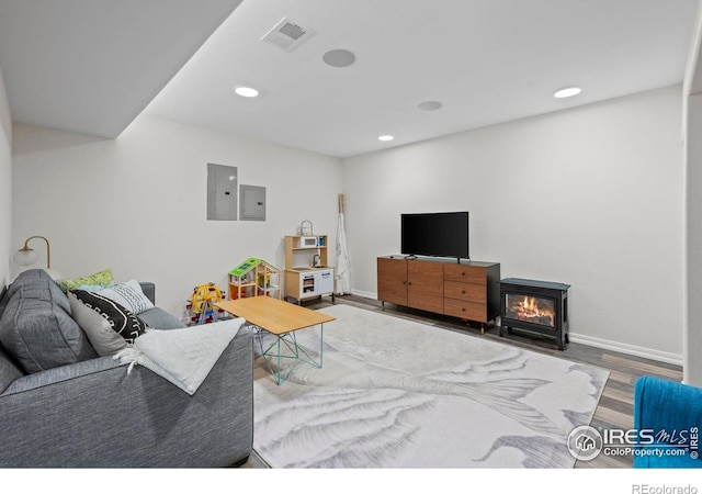 1409 Quince Ave, Boulder, CO 80304 - living area with wood finished floors, electric panel, baseboards, and recessed lighting