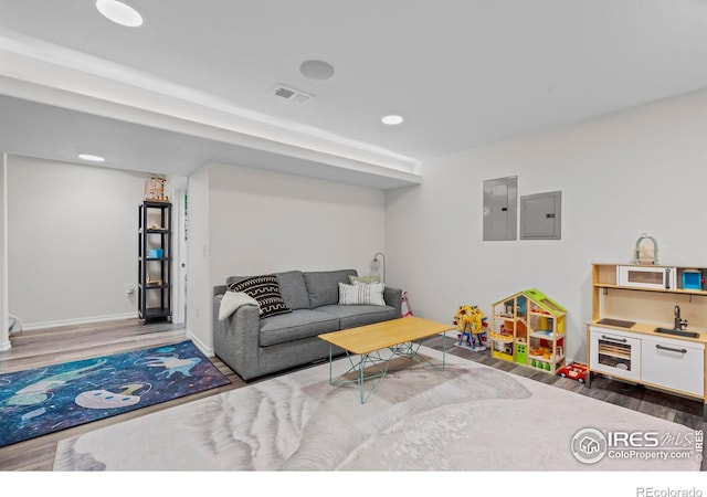 1409 Quince Ave, Boulder, CO 80304 - living area featuring wood finished floors, electric panel, recessed lighting, and baseboards