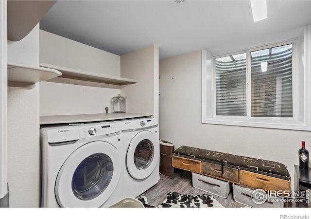 1409 Quince Ave, Boulder, CO 80304 - laundry room featuring washer and dryer and wood finished floors
