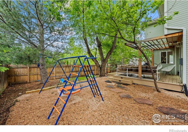 1409 Quince Ave, Boulder, CO 80304 - view of play area with a fenced backyard and a wooden deck