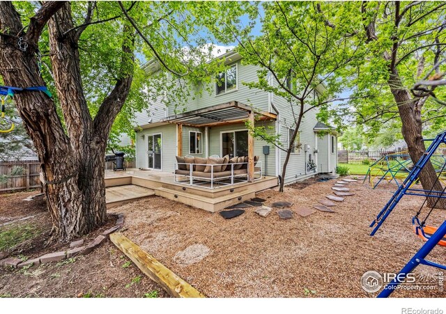 1409 Quince Ave, Boulder, CO 80304 - rear view of house with a playground and a deck