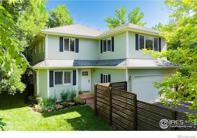 1409 Quince Ave, Boulder, CO 80304 - traditional-style house with an attached garage, a front lawn, roof with shingles, and driveway