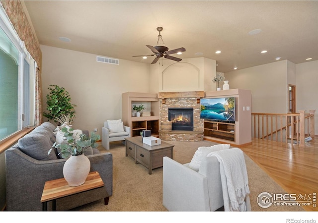 6787 Spanish Bay Dr, Windsor, CO 80550 - living area featuring a brick fireplace, recessed lighting, and a ceiling fan