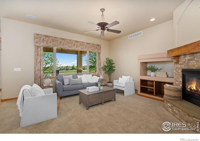 6787 Spanish Bay Dr, Windsor, CO 80550 - living room with carpet floors, a ceiling fan, a glass covered fireplace, recessed lighting, and baseboards