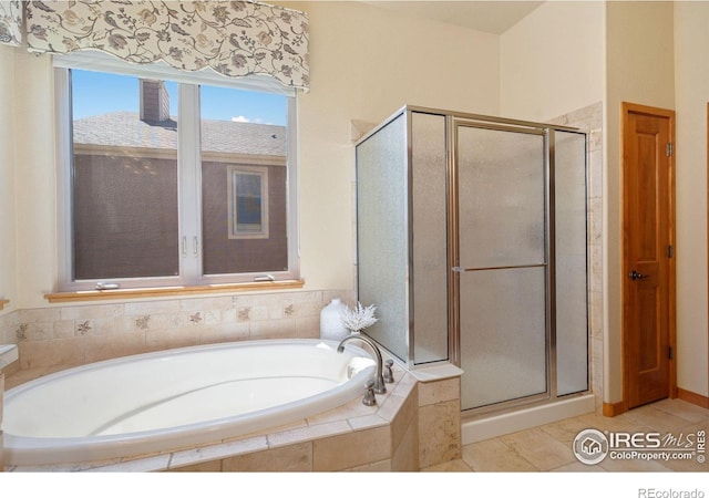 6787 Spanish Bay Dr, Windsor, CO 80550 - full bathroom featuring a stall shower, a garden tub, and tile patterned flooring