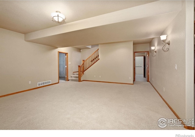 6787 Spanish Bay Dr, Windsor, CO 80550 - finished basement with carpet, baseboards, and stairway