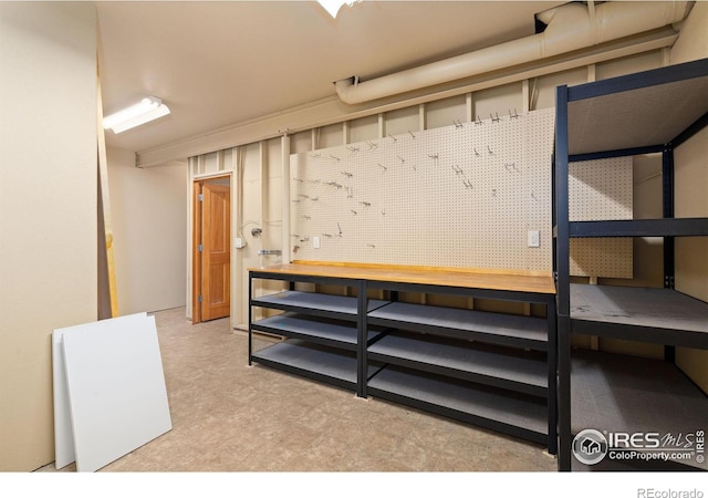 6787 Spanish Bay Dr, Windsor, CO 80550 - basement featuring a workshop area and tile patterned floors