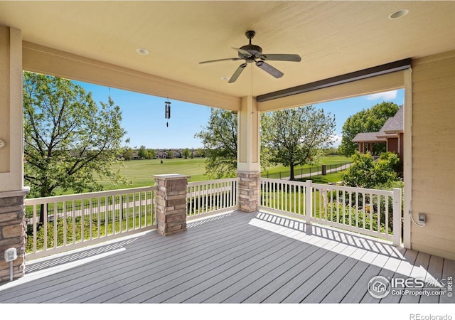 6787 Spanish Bay Dr, Windsor, CO 80550 - wooden terrace featuring ceiling fan and golf course view