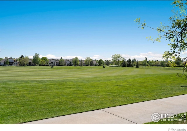 6787 Spanish Bay Dr, Windsor, CO 80550 - view of property's community featuring view of golf course and a lawn