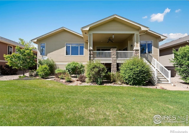 6787 Spanish Bay Dr, Windsor, CO 80550 - view of front of property with a front lawn, stairway, and ceiling fan