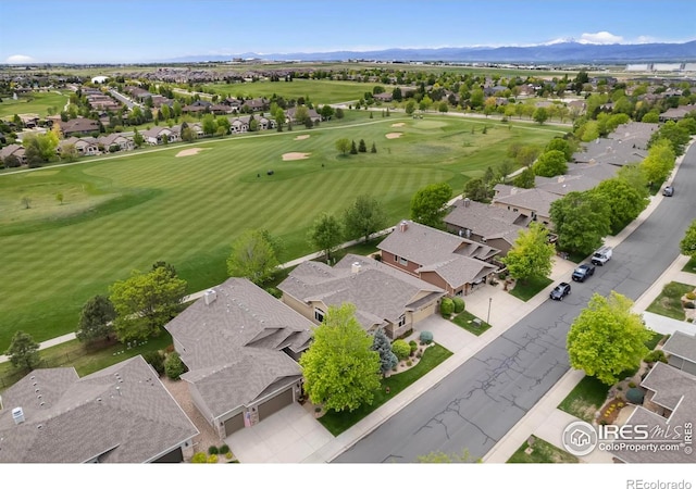 6787 Spanish Bay Dr, Windsor, CO 80550 - aerial view of residential area featuring mountains and a golf club