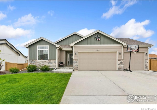 7025 Meadow Rain Way, Wellington, CO 80549 - view of front of home with a garage, stone siding, concrete driveway, and board and batten siding