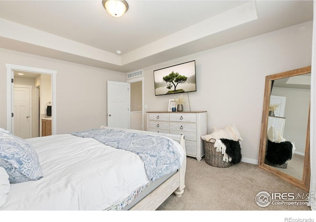7025 Meadow Rain Way, Wellington, CO 80549 - carpeted bedroom featuring a tray ceiling and baseboards