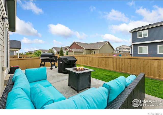 7025 Meadow Rain Way, Wellington, CO 80549 - fenced backyard with an outdoor living space with a fire pit, grilling area, a residential view, and a patio area