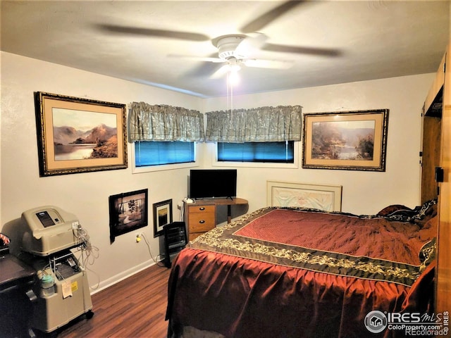 402 N Washington Ave, Fleming, CO 80728 - bedroom with dark wood-type flooring, baseboards, and ceiling fan