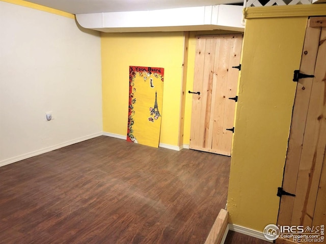402 N Washington Ave, Fleming, CO 80728 - basement featuring wood finished floors and baseboards