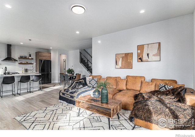3580 W 62nd Pl, Denver, CO 80221 - living room with stairs, recessed lighting, and light wood-style flooring