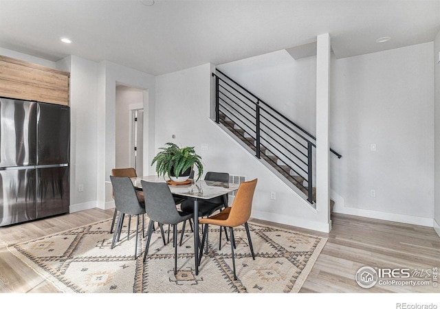 3580 W 62nd Pl, Denver, CO 80221 - dining room featuring light wood-style floors, baseboards, stairs, and recessed lighting