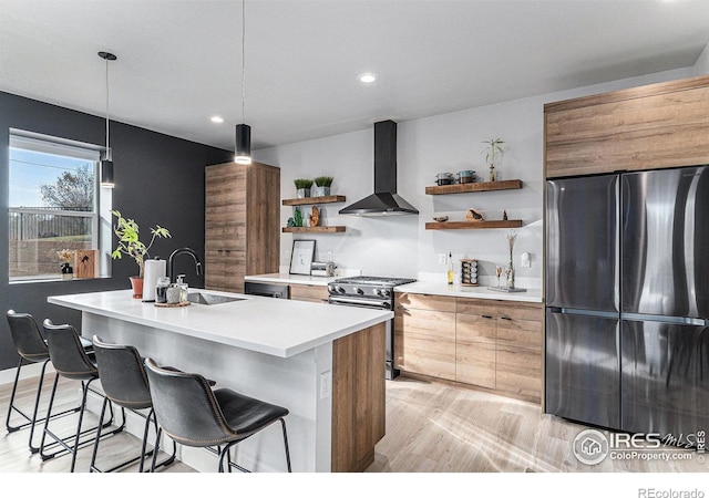 3580 W 62nd Pl, Denver, CO 80221 - kitchen featuring freestanding refrigerator, wall chimney range hood, open shelves, a sink, and gas stove