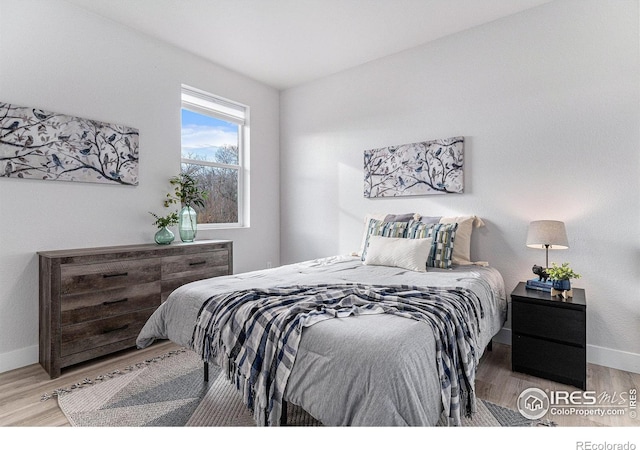 3580 W 62nd Pl, Denver, CO 80221 - bedroom with wood finished floors and baseboards