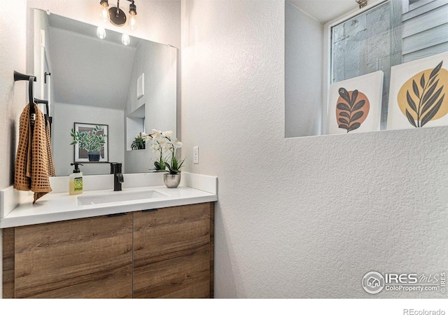 3580 W 62nd Pl, Denver, CO 80221 - bathroom with vanity and a textured wall