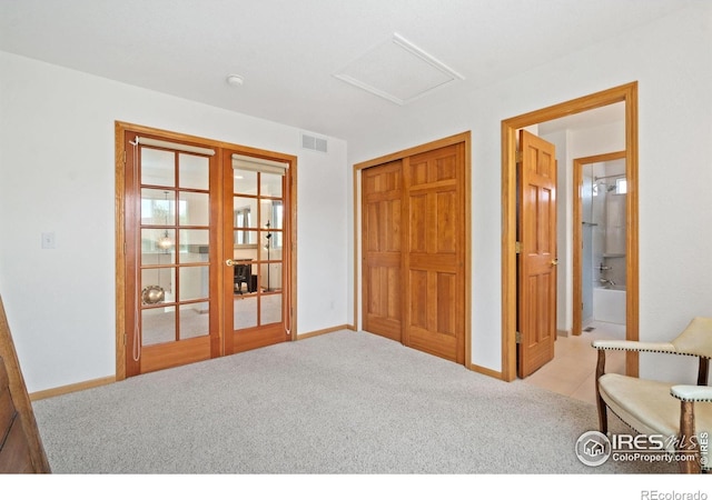 140 Camino Real Ft, Collins, CO 80524 - bedroom with french doors, attic access, carpet flooring, a closet, and baseboards