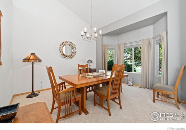 140 Camino Real Ft, Collins, CO 80524 - dining area with vaulted ceiling, a chandelier, light carpet, and baseboards