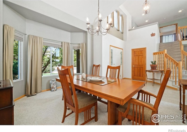 140 Camino Real Ft, Collins, CO 80524 - dining area featuring a chandelier, stairs, baseboards, recessed lighting, and a high ceiling
