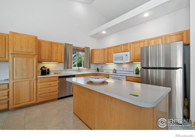 140 Camino Real Ft, Collins, CO 80524 - kitchen featuring stainless steel appliances, high vaulted ceiling, a sink, light countertops, and light tile patterned floors