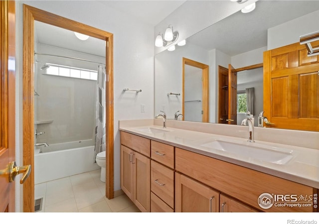 140 Camino Real Ft, Collins, CO 80524 - bathroom with double vanity, toilet, shower / tub combo with curtain, and tile patterned flooring