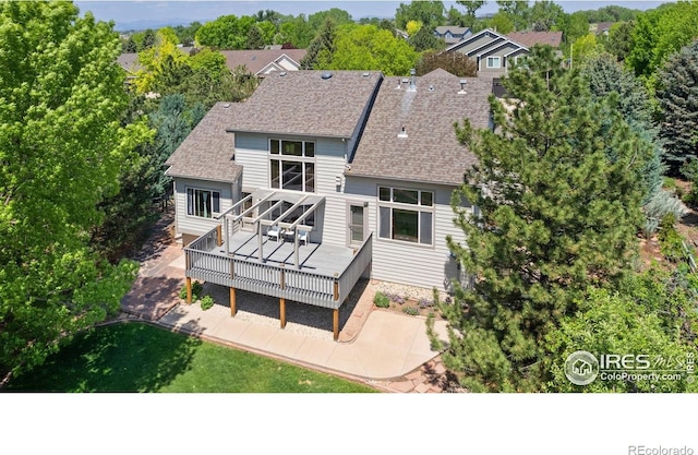 140 Camino Real Ft, Collins, CO 80524 - rear view of house featuring a deck, roof with shingles, and a patio area