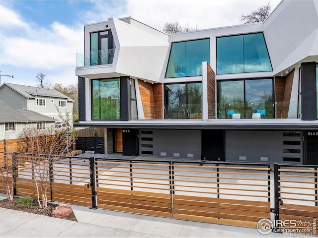 944 Arapahoe Ave Unit A, Boulder, CO 80302 - contemporary house featuring a fenced front yard