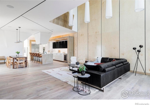 944 Arapahoe Ave Unit A, Boulder, CO 80302 - living room featuring light wood finished floors and beverage cooler