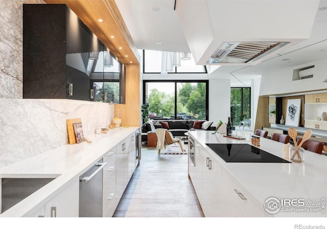 944 Arapahoe Ave Unit A, Boulder, CO 80302 - kitchen featuring black electric stovetop, open floor plan, modern cabinets, white cabinetry, and recessed lighting