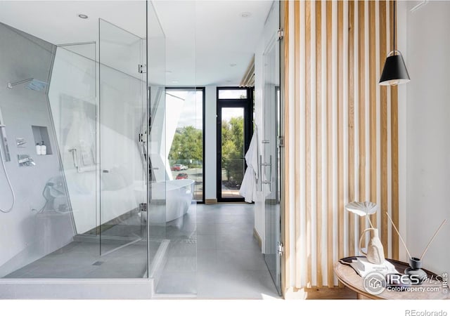 944 Arapahoe Ave Unit A, Boulder, CO 80302 - bathroom featuring a stall shower, floor to ceiling windows, and tile patterned floors