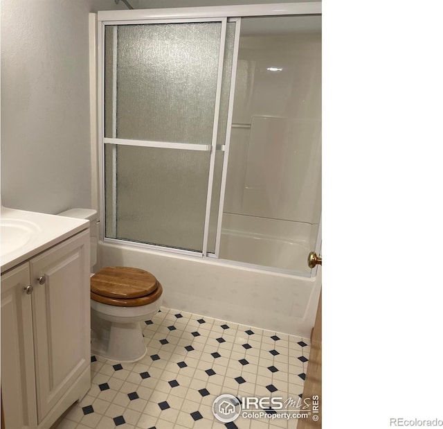 1126 Patricia Dr, Loveland, CO 80537 - full bathroom with toilet, vanity, and combined bath / shower with glass door