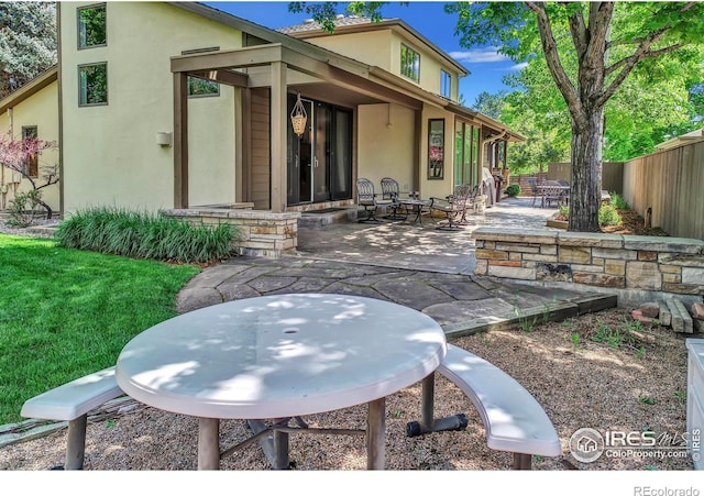 3345 15th St, Boulder, CO 80304 - rear view of property with stucco siding and a patio area