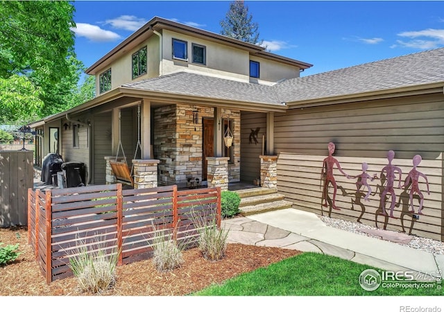 3345 15th St, Boulder, CO 80304 - view of front of property with covered porch, stone siding, a shingled roof, and stucco siding
